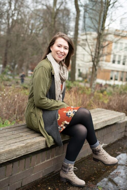 Editor Kelly Morrison sitting on a bench